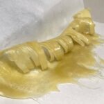 curled up freshly pressed hash rosin