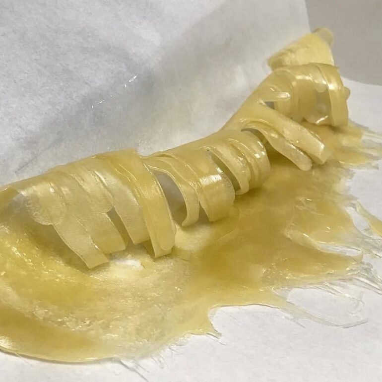 curled up freshly pressed hash rosin