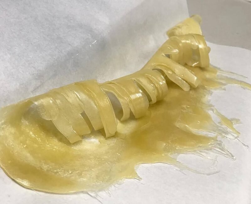 curled up freshly pressed hash rosin