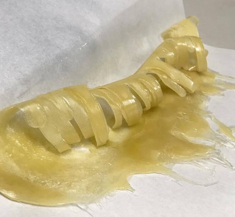 curled up freshly pressed hash rosin