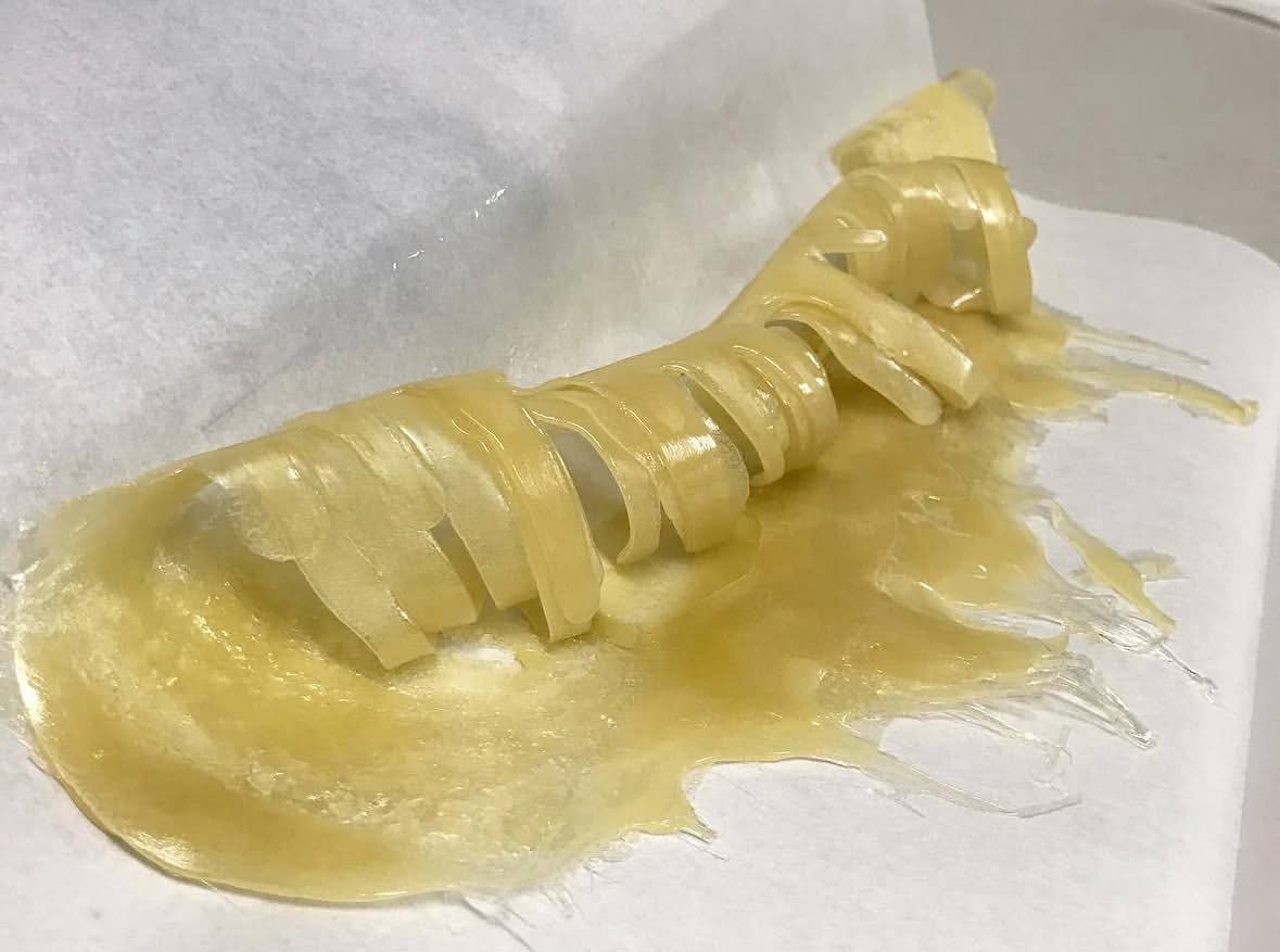 curled up freshly pressed hash rosin